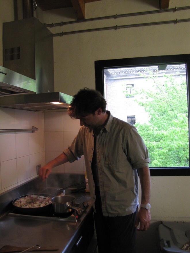 Stefano cooking risotto for the camino gang in Pamplona